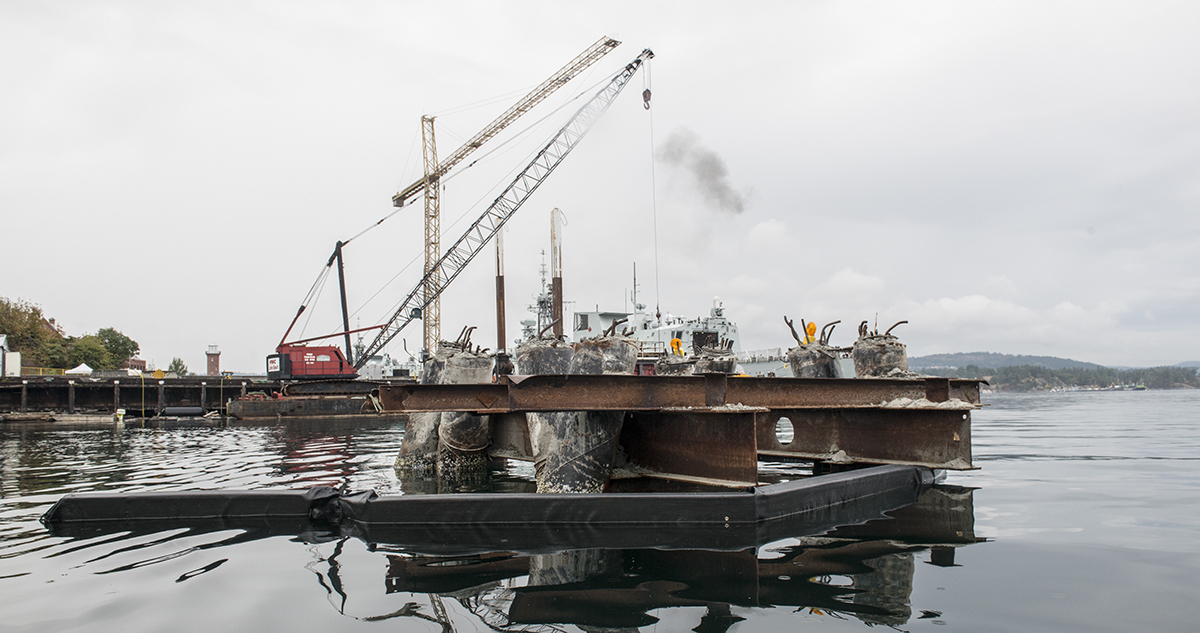Piles from the demolished B Jetty crane at high tide. The piles and rock anchors will be cut after dredging.
